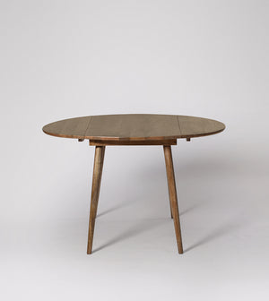 Rond way Solid Wood Dining Table in Brown Finish